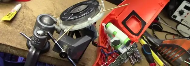 Vacuum cleaner repair parts and tools on a workbench in San Diego, CA